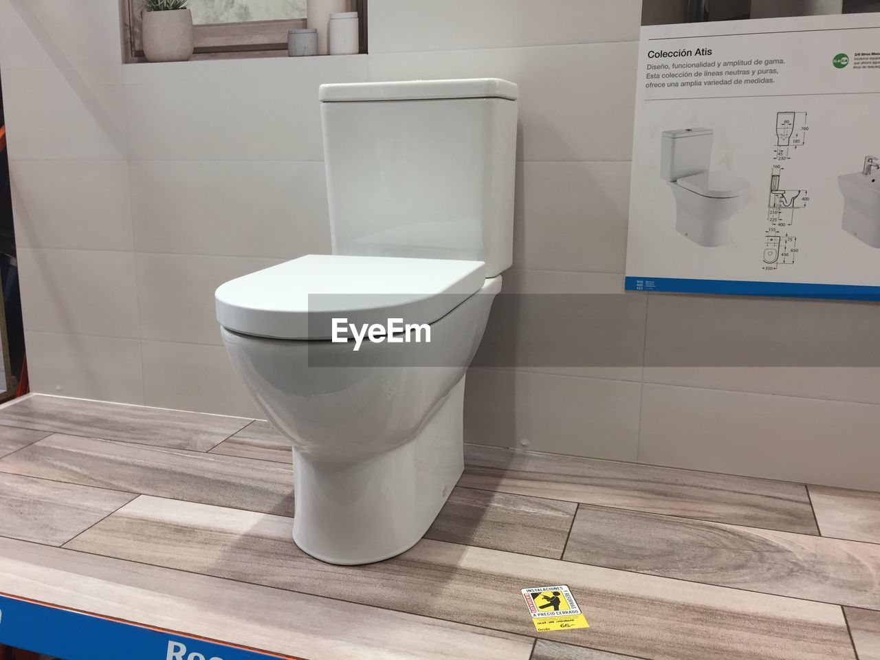 LOW ANGLE VIEW OF MAN IN BATHROOM AT HOME