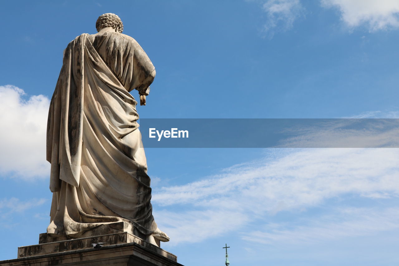 Low angle view of statue against sky