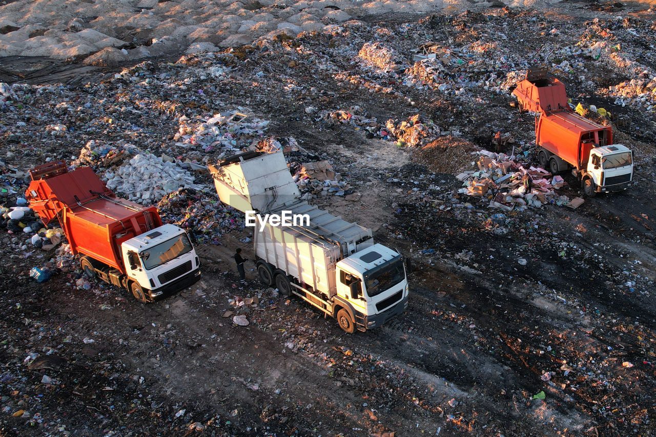 Landfill waste disposal. garbage dump with waste plastic. garbage truck unload rubbish in landfill. 