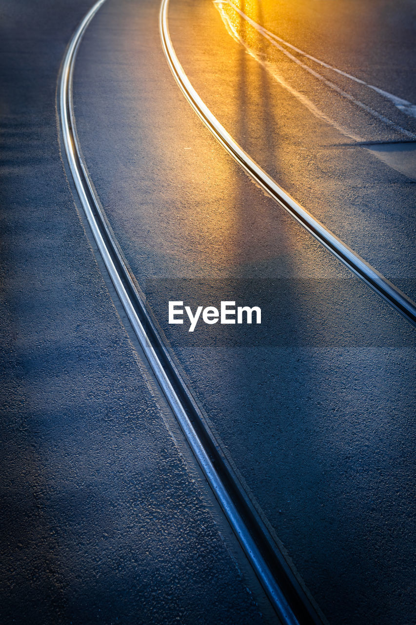 High angle view of railroad track in city at night