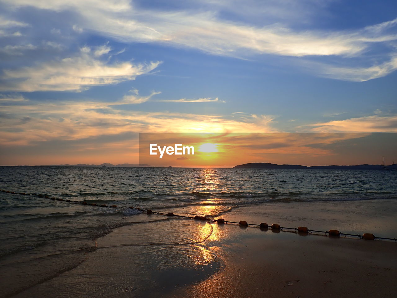 SCENIC VIEW OF SEA DURING SUNSET