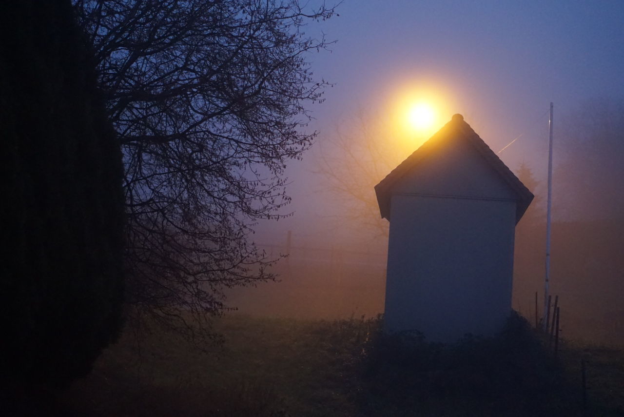 darkness, light, dawn, architecture, sky, morning, sunlight, sunrise, built structure, fog, nature, tree, plant, building exterior, sun, no people, silhouette, building, tranquility, outdoors, beauty in nature, cloud, mist, landscape, back lit, house, land, bare tree, scenics - nature, environment