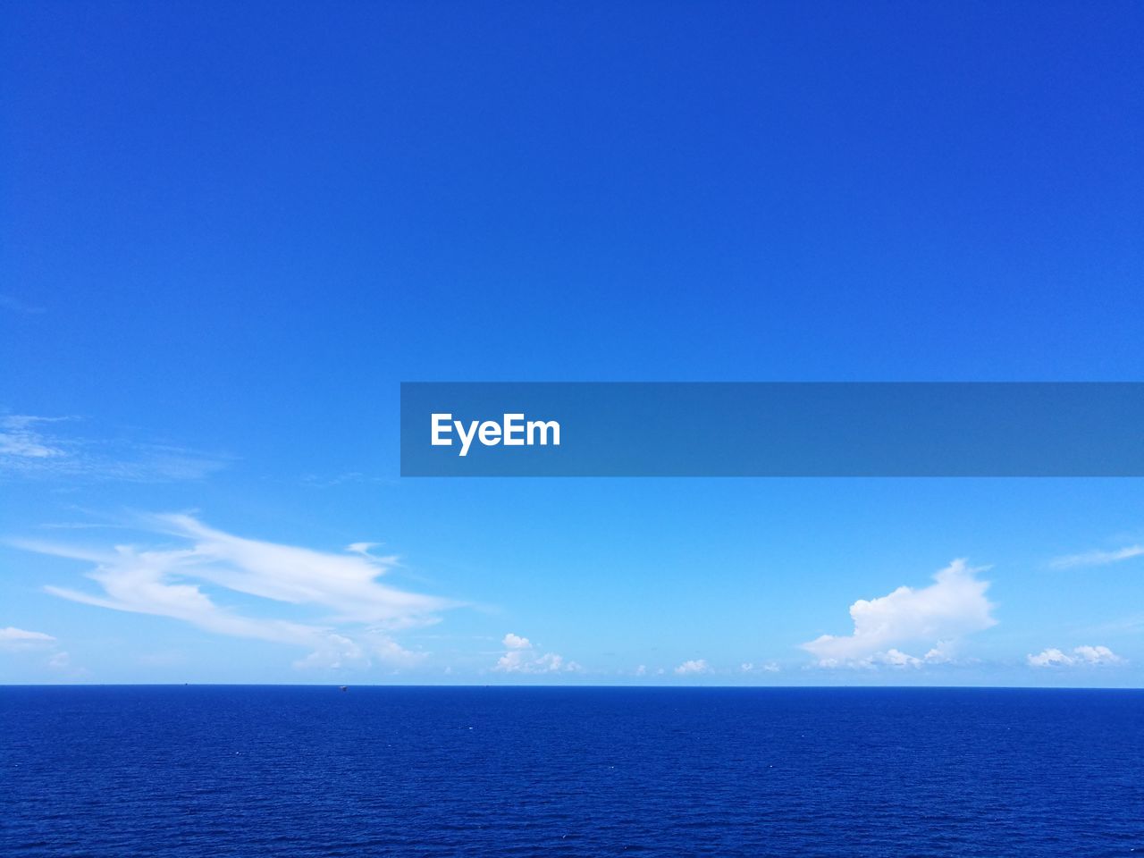 VIEW OF SEA AGAINST BLUE SKY