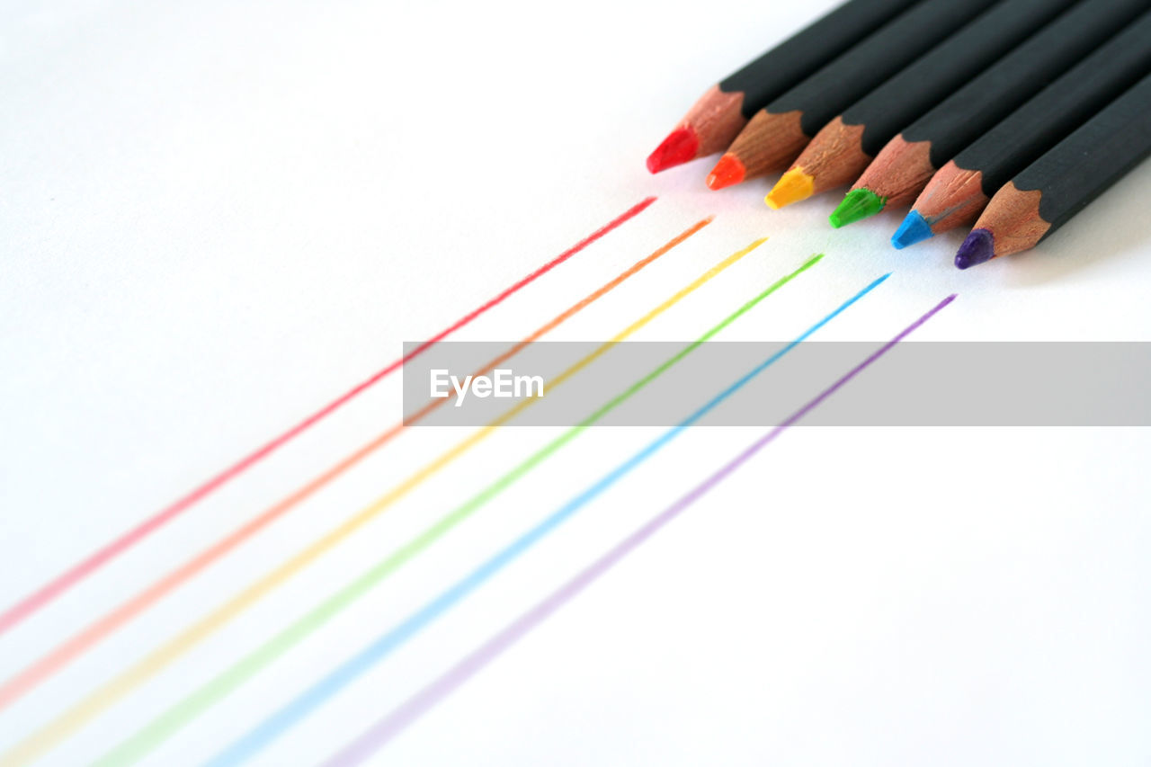 Colorful pencils on white background