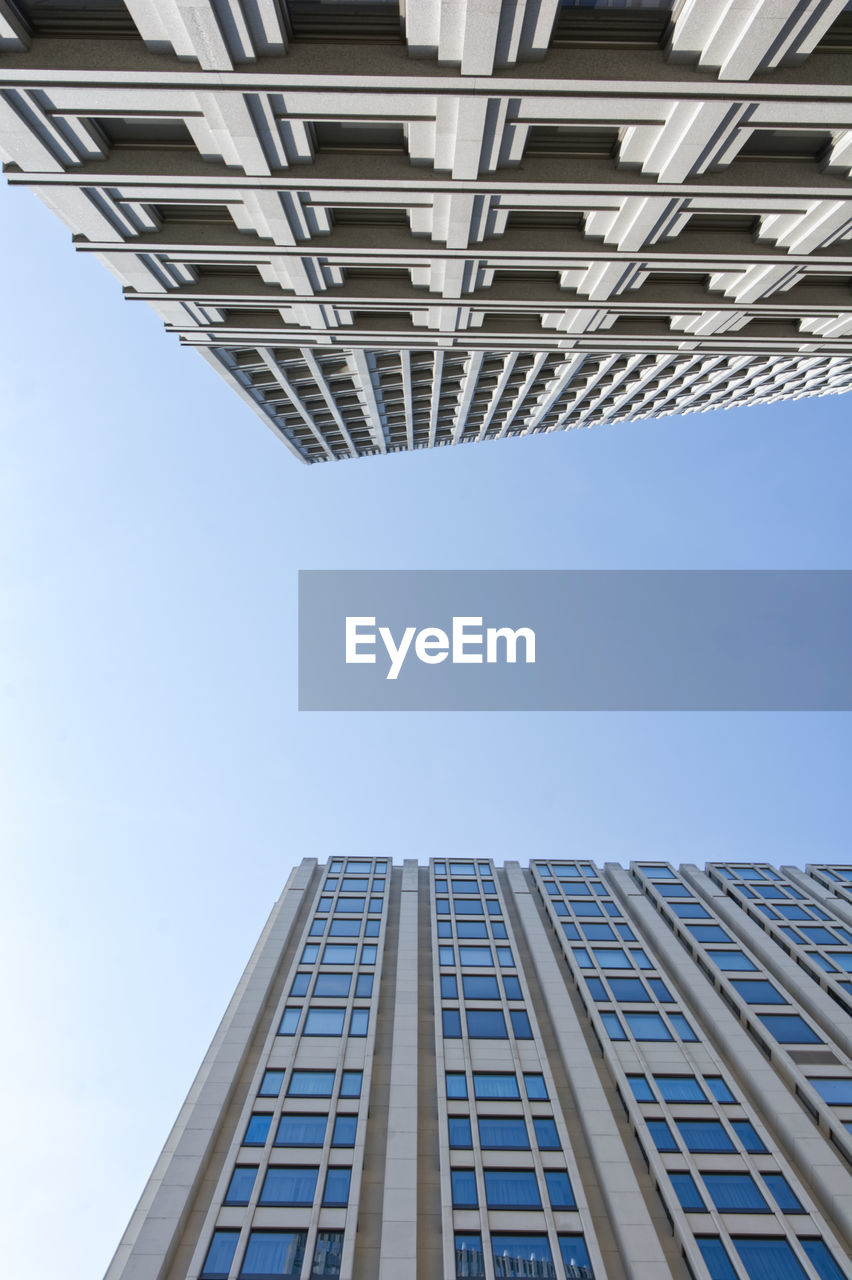 LOW ANGLE VIEW OF BUILDINGS AGAINST CLEAR SKY