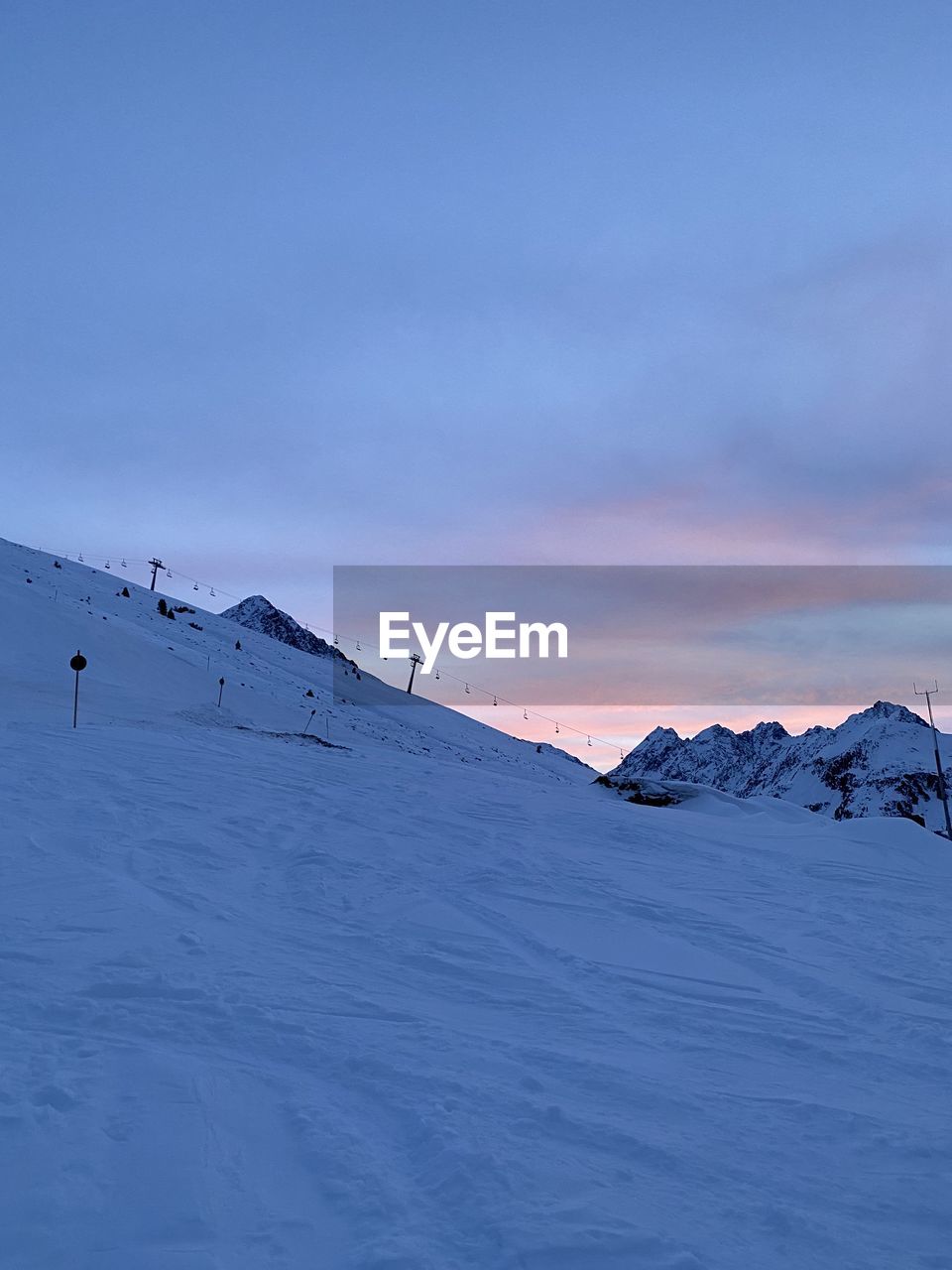 blue, mountain, snow, nature, winter, cold temperature, beauty in nature, scenics - nature, day, sports, environment, landscape, travel, mountain range, outdoors, sky, winter sports, skiing, non-urban scene, land, adventure, tranquility, travel destinations, sunlight, extreme sports, vacation, tranquil scene