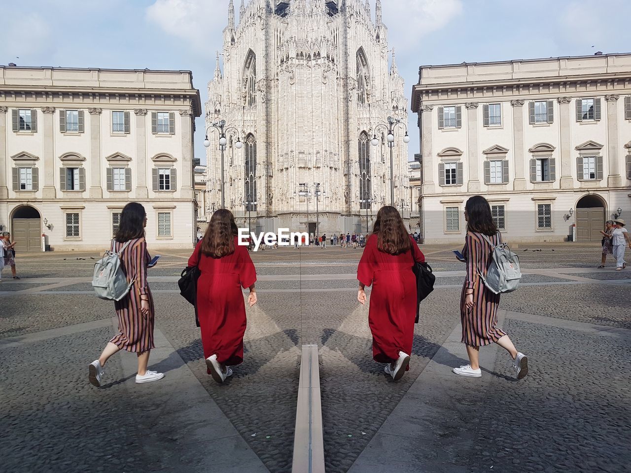 GROUP OF PEOPLE WALKING ON STREET