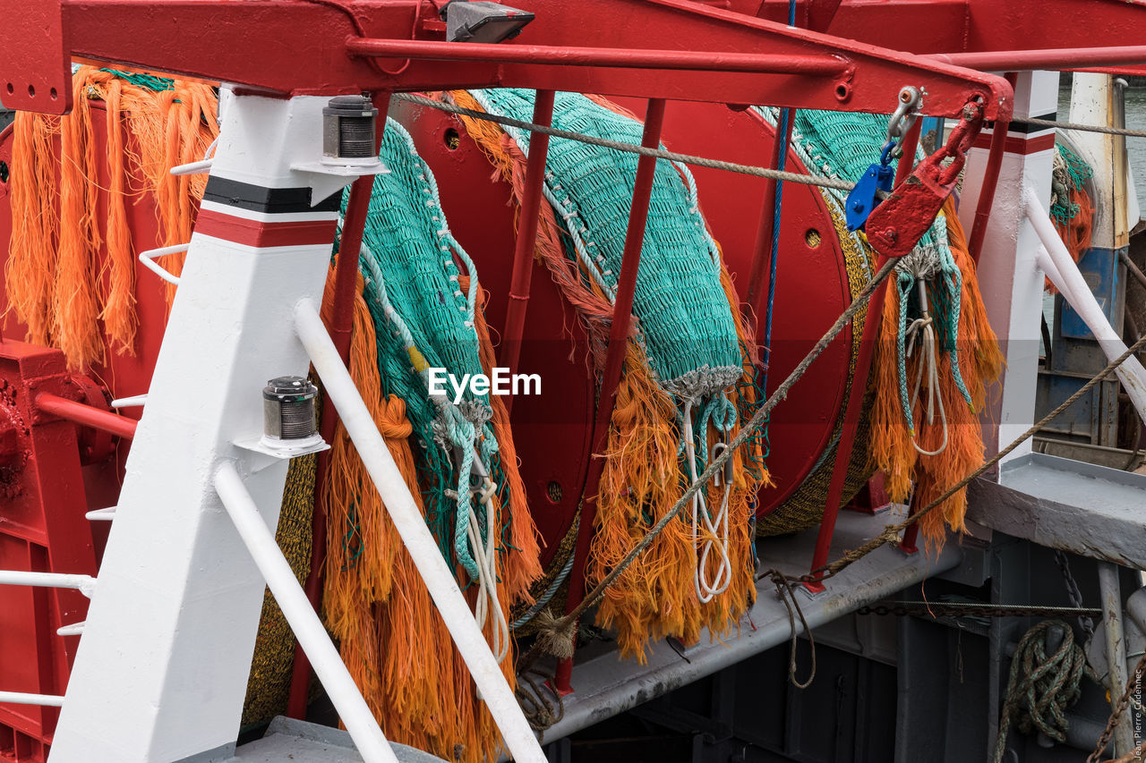 Rolled up fishing nets at harbor