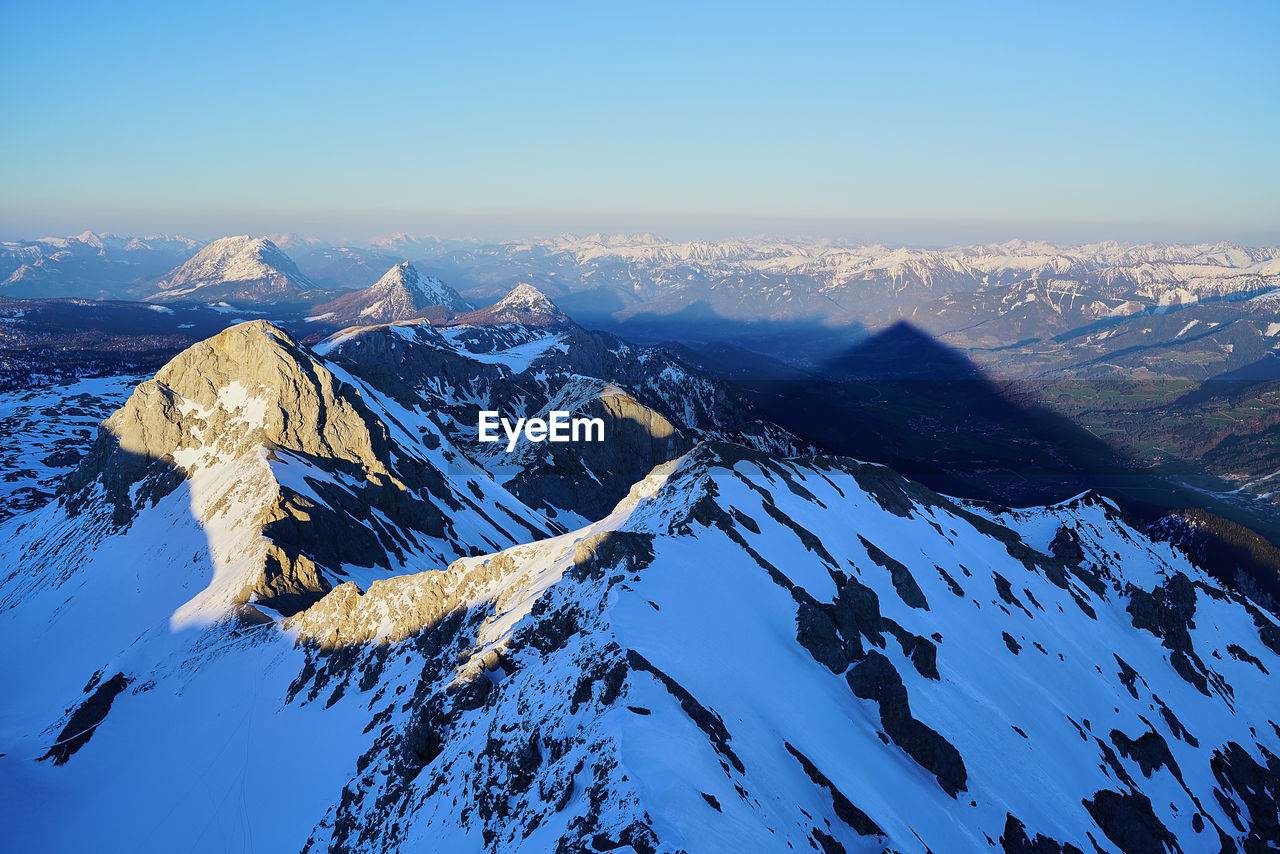 Scenic view of snow covered mountain against sky 