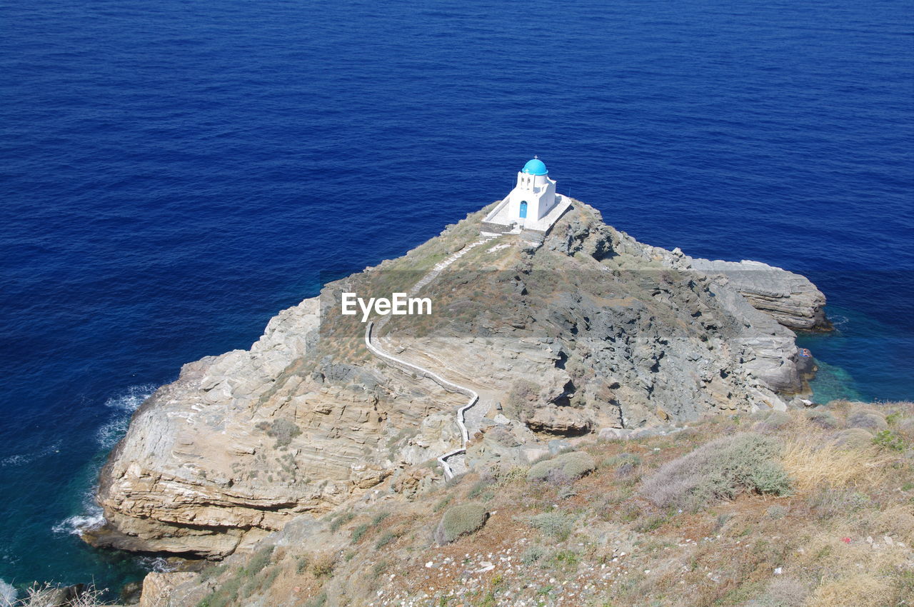 High angle view of sea by cliff