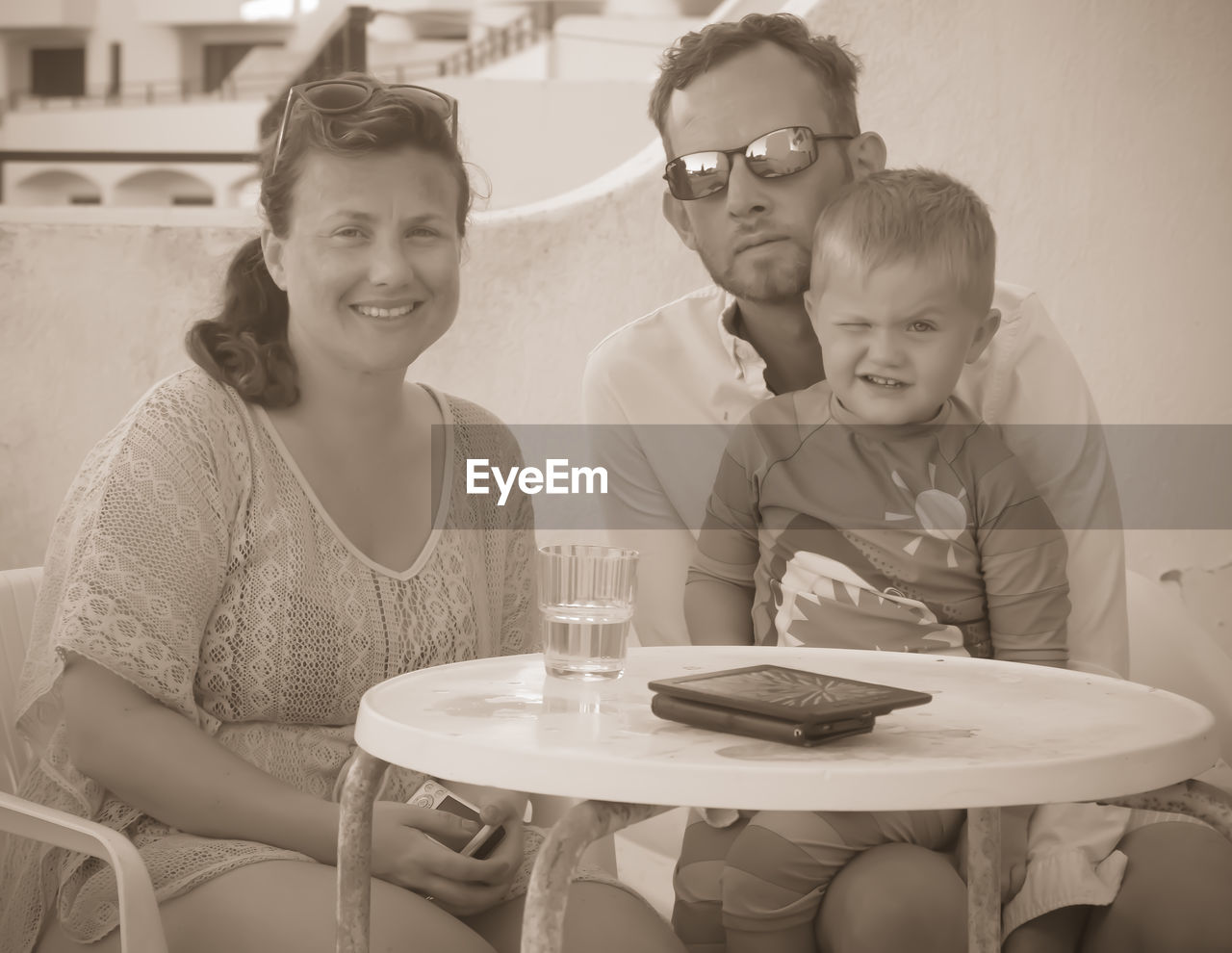 Portrait of family sitting at outdoor cafe