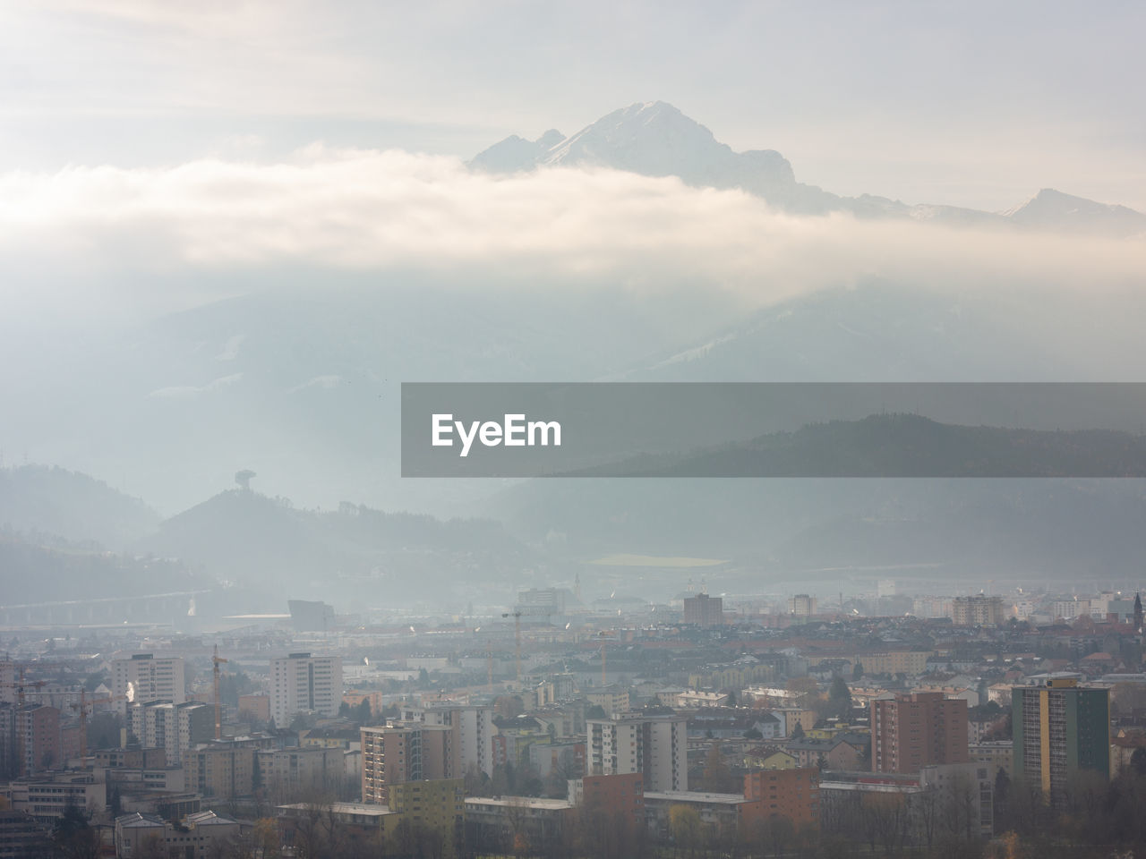 View over the city of innsbruck on a hazy winter afternoon