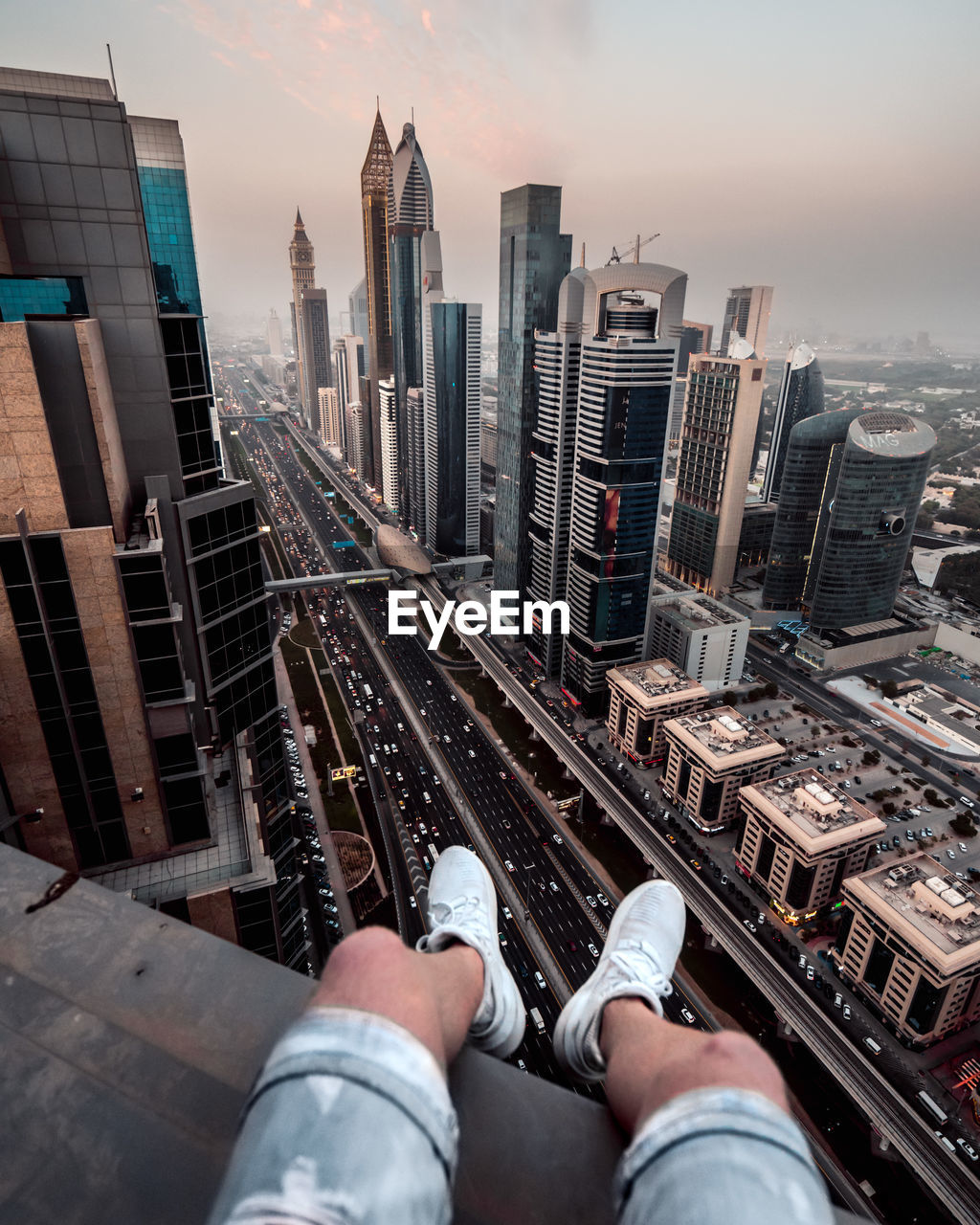 Low section of man against buildings in city