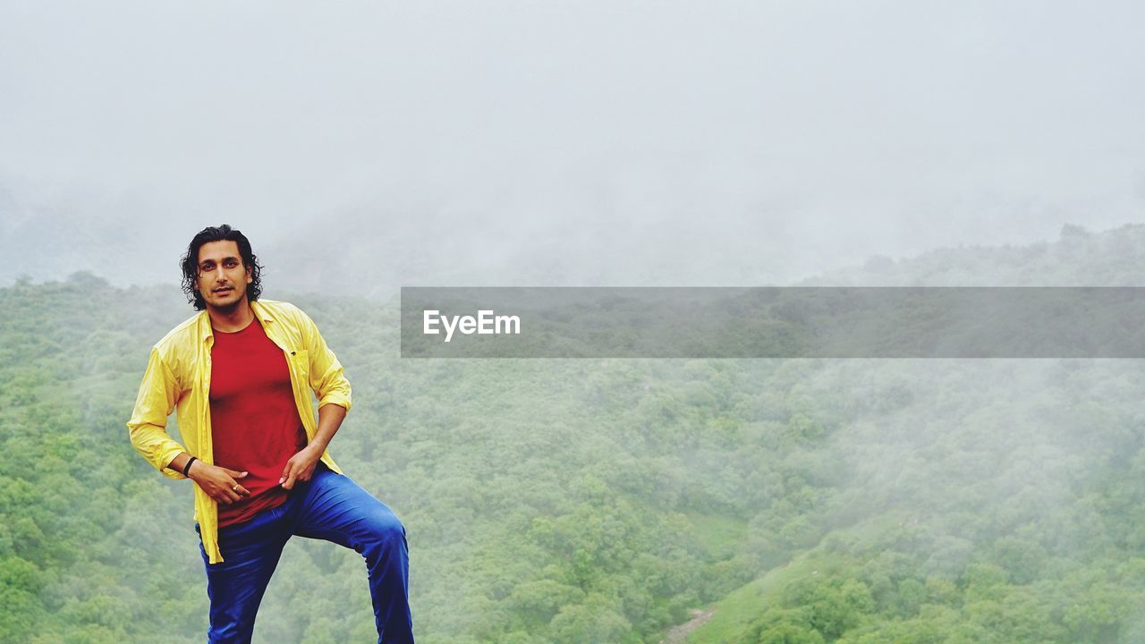 Portrait of man standing on mountain