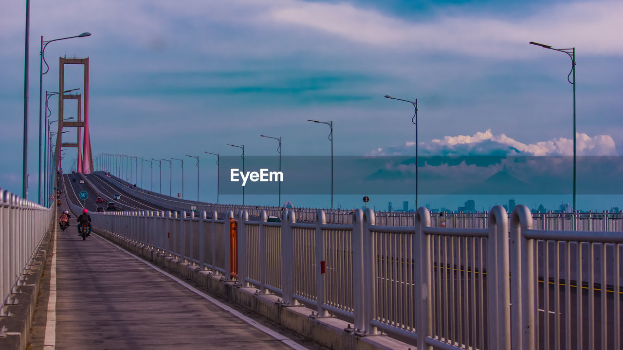 BRIDGE AGAINST SKY AT DUSK