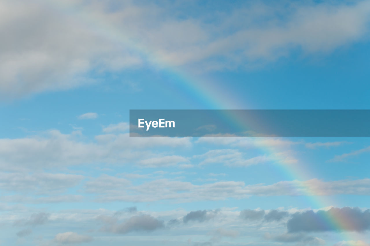 Rainbow and clouds Cloud - Sky Sky Beauty In Nature Tranquility Scenics - Nature Tranquil Scene Low Angle View Rainbow No People Nature Blue Idyllic Day Outdoors Backgrounds Cloudscape Meteorology Full Frame Heaven