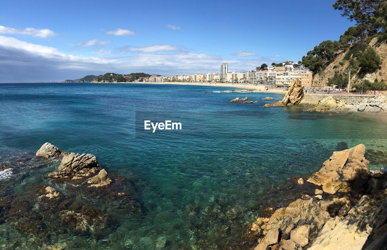 Scenic view of sea against blue sky