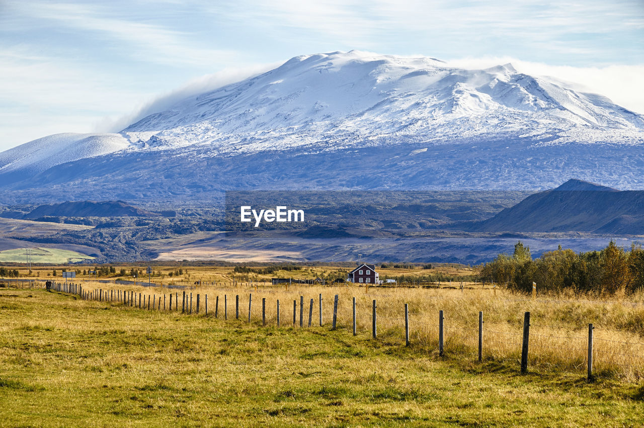 Scenic view of snowcapped mountains against sky