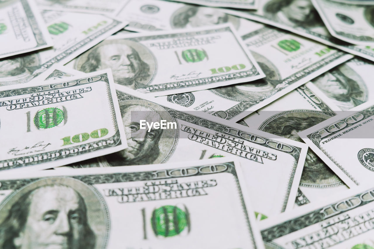 FULL FRAME SHOT OF COINS ON PAPER