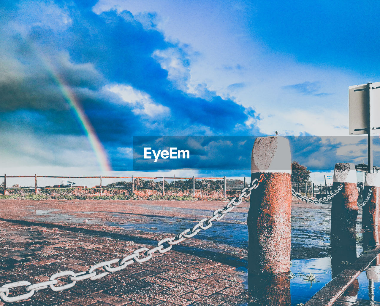 SCENIC VIEW OF RAINBOW OVER BLUE SKY