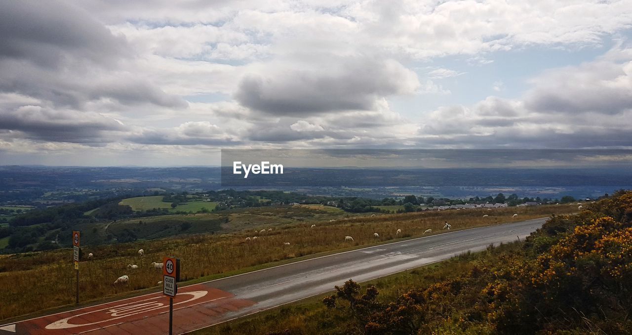 AERIAL VIEW OF LANDSCAPE AGAINST CLOUDY SKY