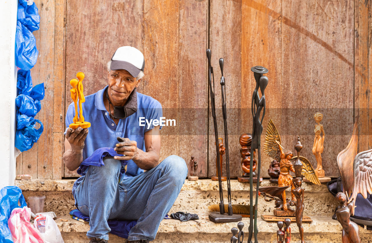 portrait of young man working at farm