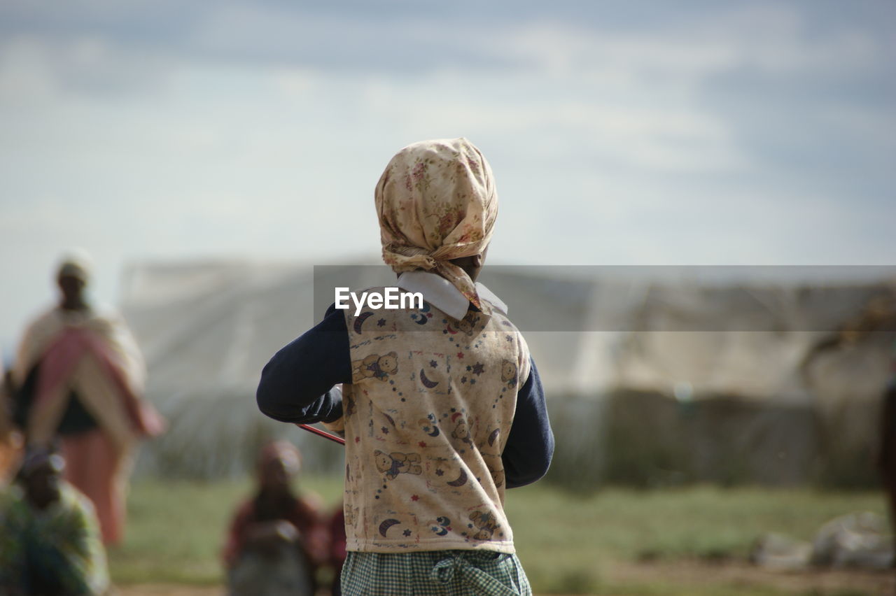 Rear view of a woman on landscape