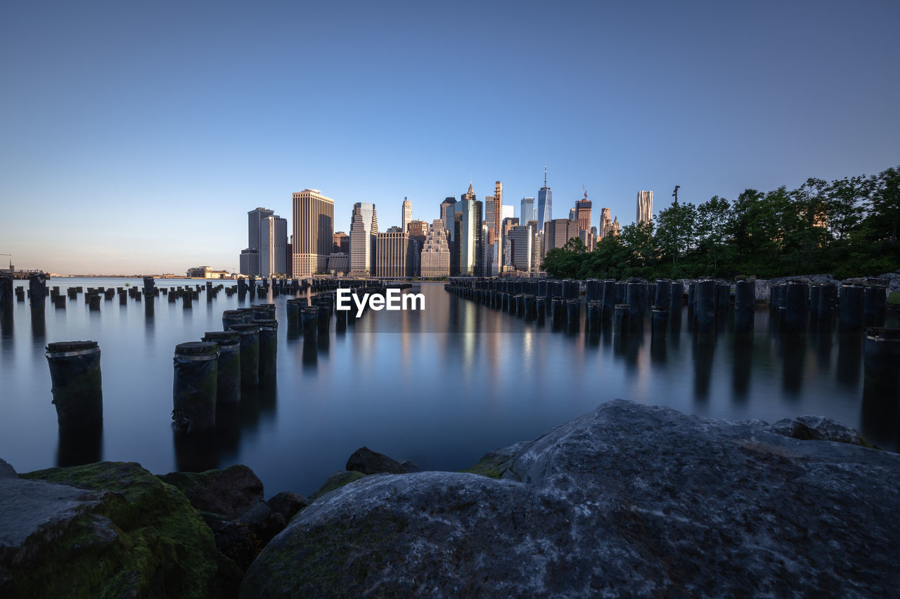 PANORAMIC VIEW OF RIVER AND BUILDINGS AGAINST SKY