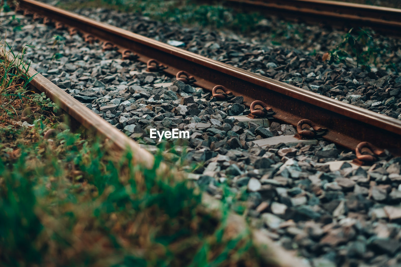 High angle view of railroad track amidst field