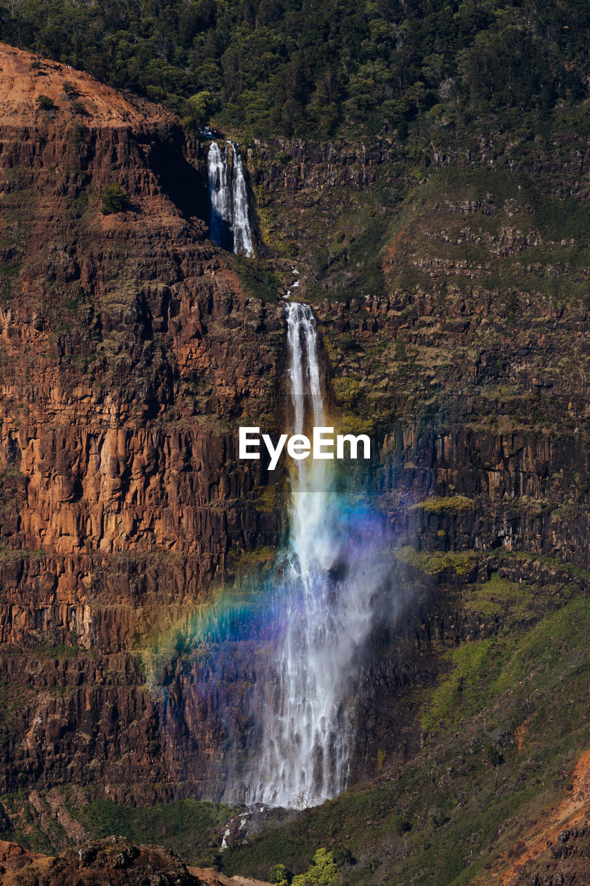 Low angle view of waterfall in hawaii