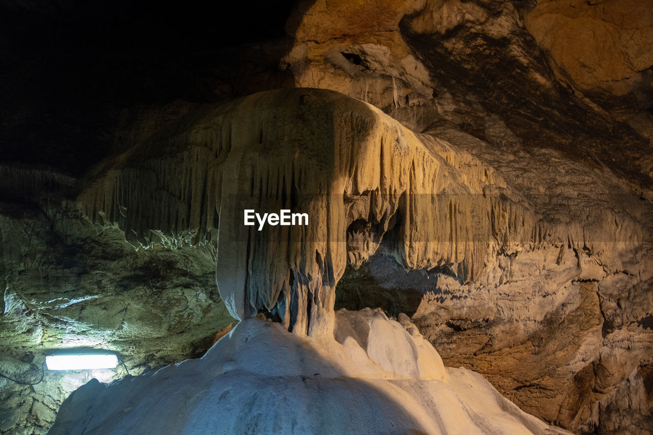 VIEW OF CAVE IN CANYON