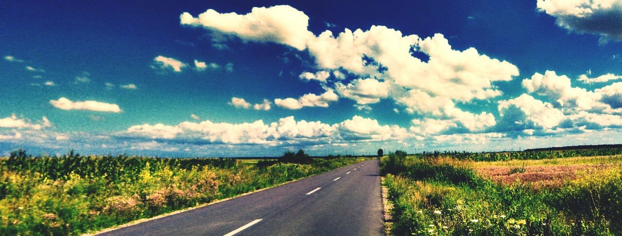 SCENIC VIEW OF COUNTRY ROAD AGAINST CLOUDY SKY