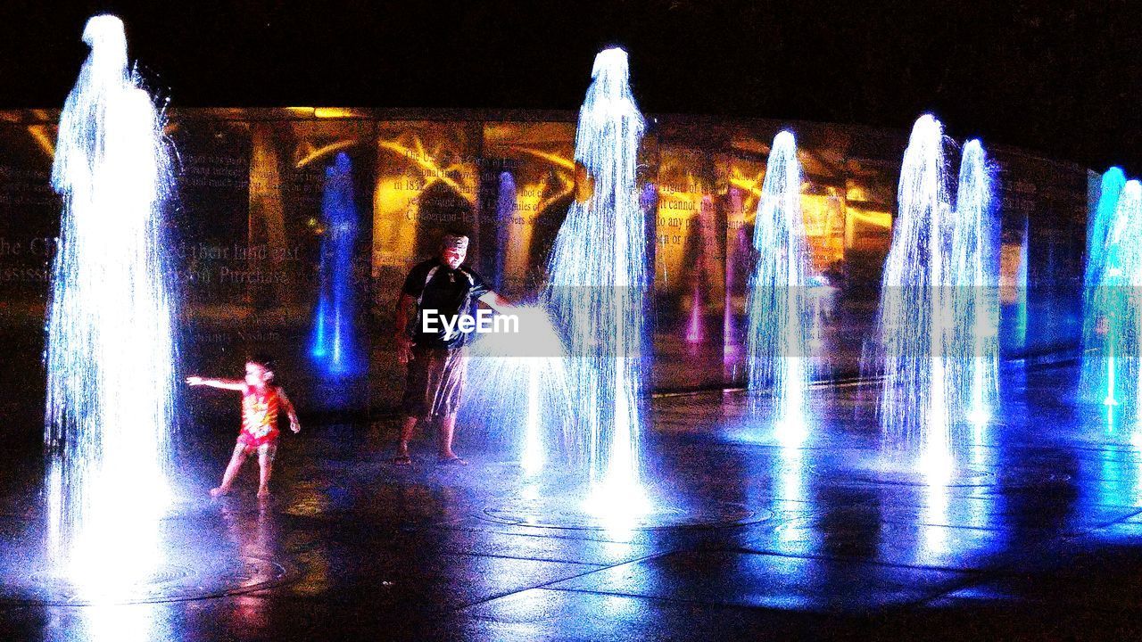 ILLUMINATED FOUNTAIN AT NIGHT