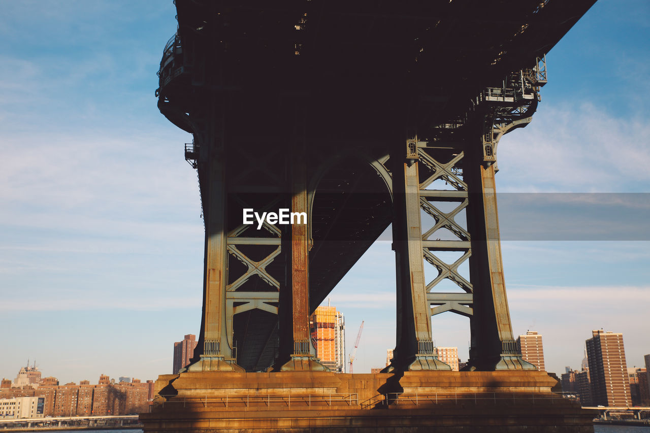 Low angle view of manhattan bridge against sky