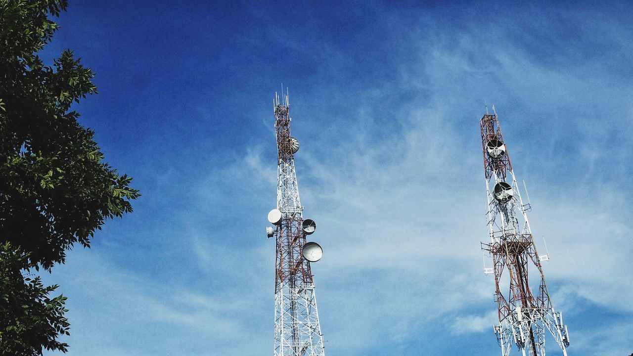 LOW ANGLE VIEW OF COMMUNICATION TOWER AGAINST SKY