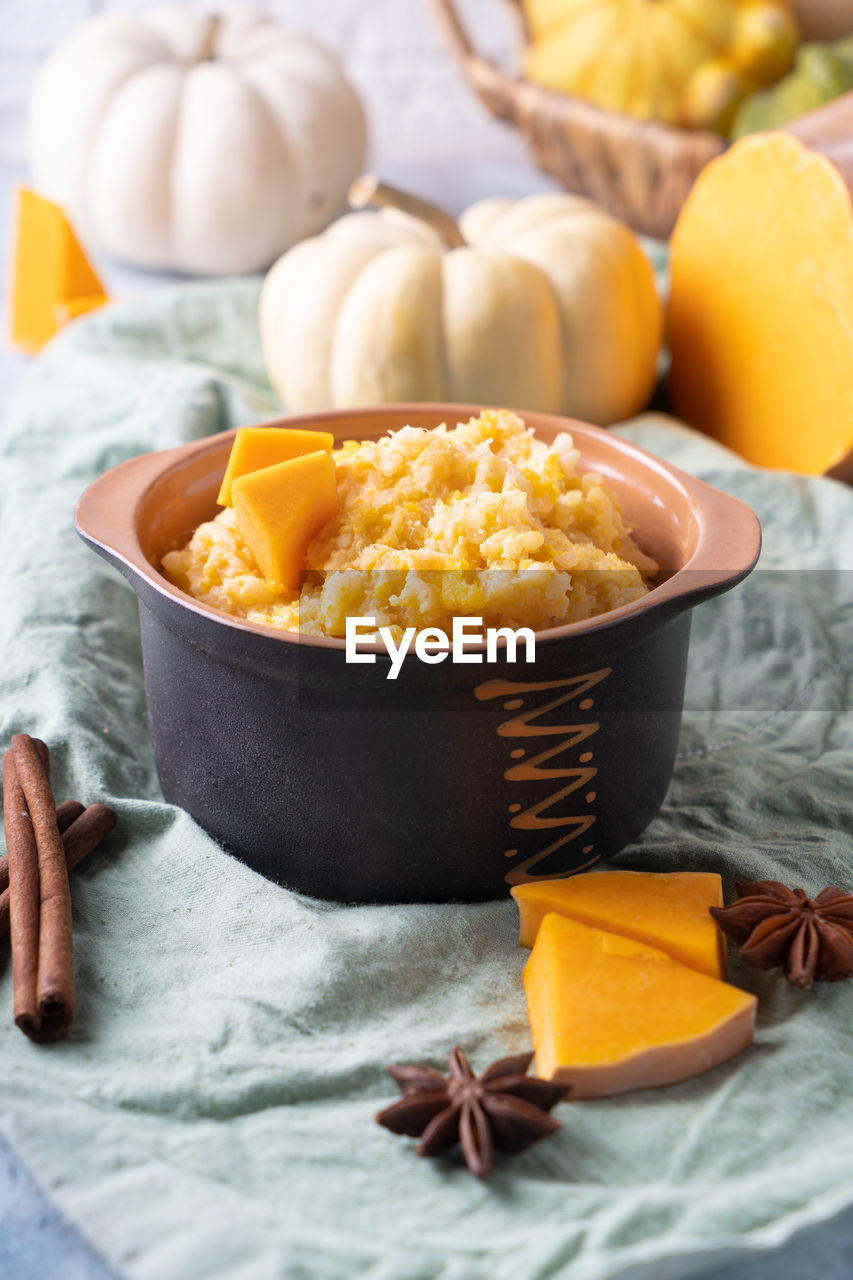 food and drink, food, dish, healthy eating, freshness, breakfast, produce, wellbeing, no people, bowl, studio shot, vegetable, meal, fruit, spice, indoors, pumpkin, dessert, ingredient, wood, rustic, yellow, textile, plant