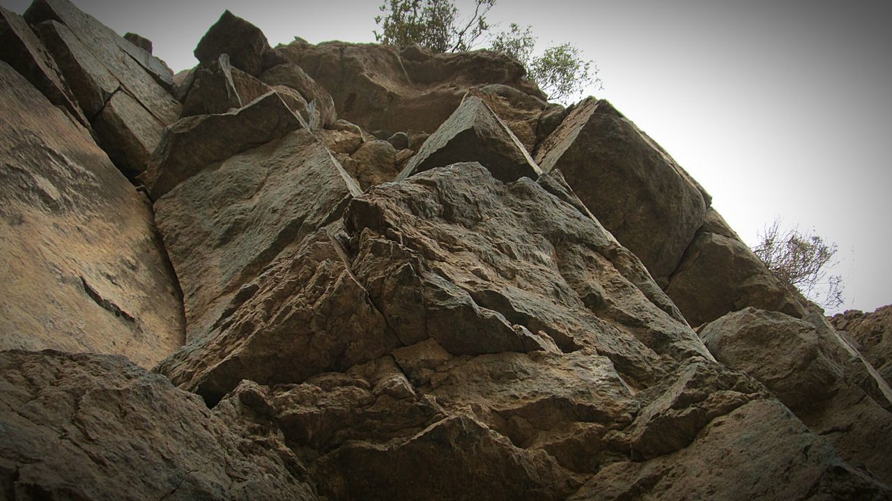 LOW ANGLE VIEW OF ROCK FORMATION