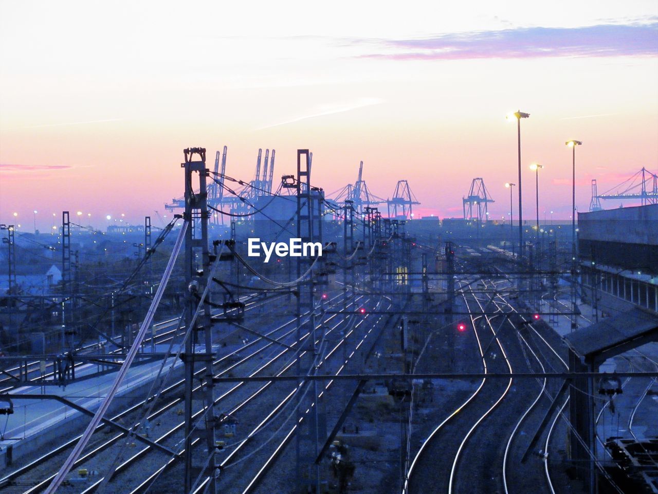 HIGH ANGLE VIEW OF RAILROAD TRACKS AT SUNSET