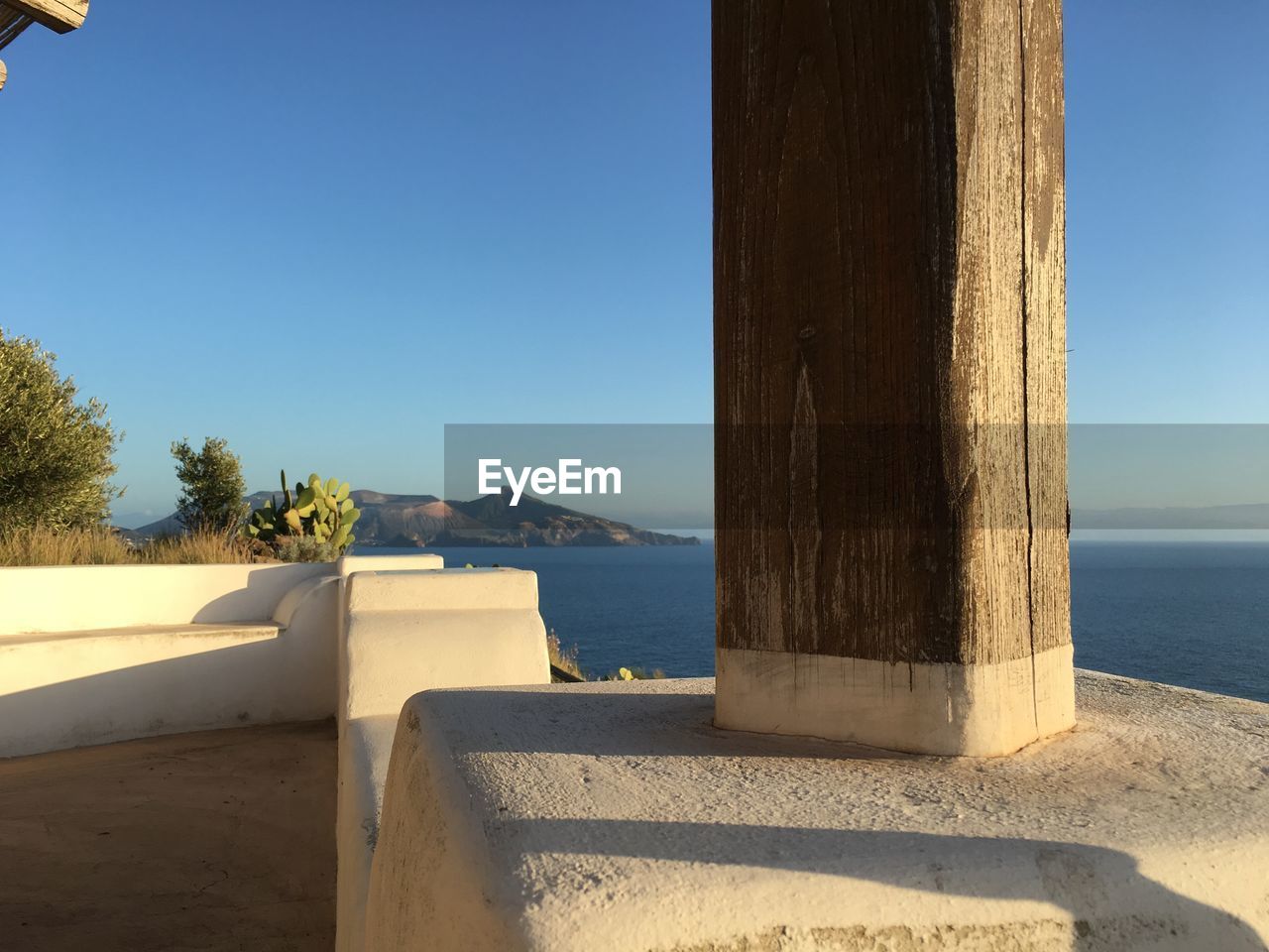 Scenic view of sea against clear blue sky