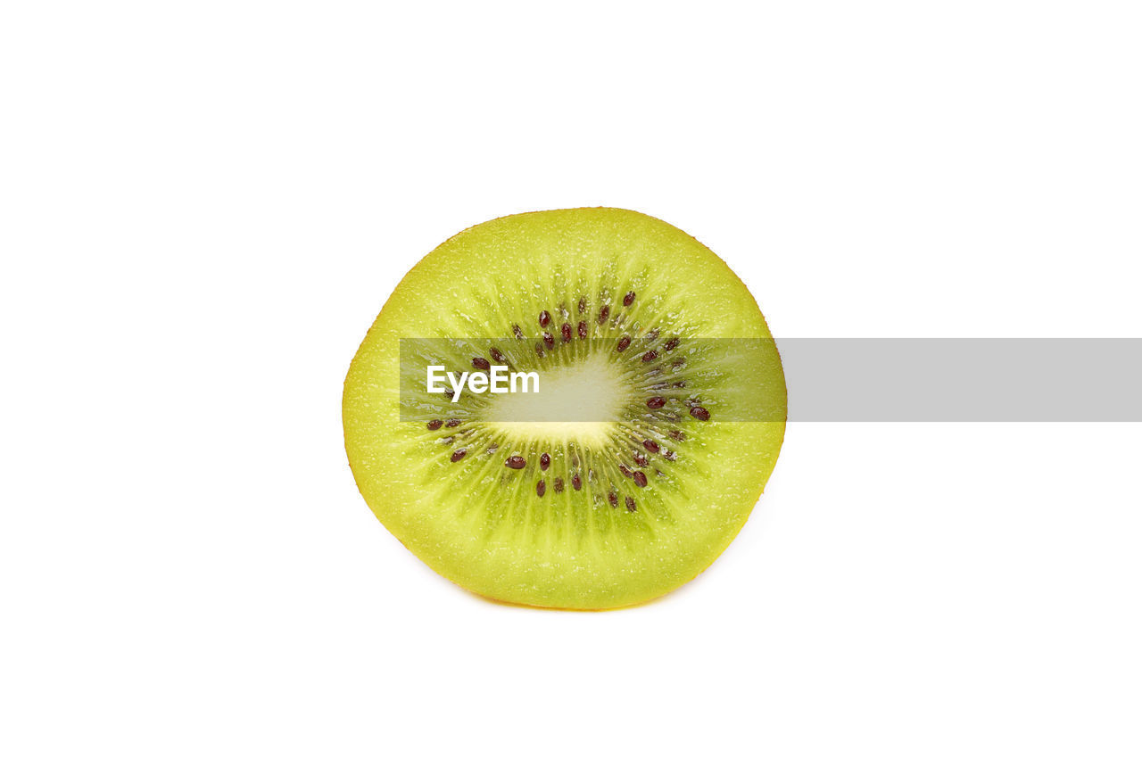 Close-up of kiwi against white background