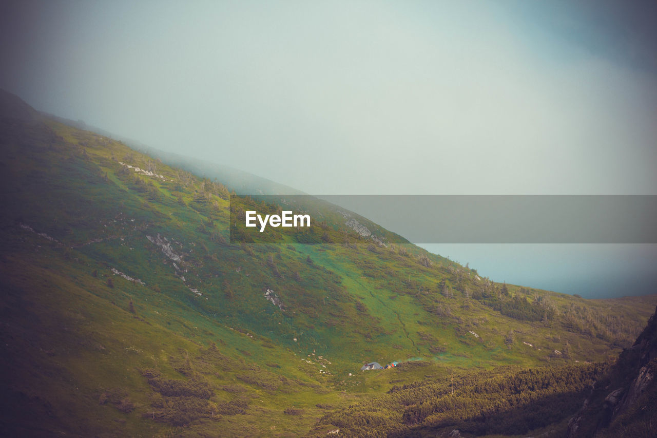 SCENIC VIEW OF MOUNTAIN AGAINST SKY