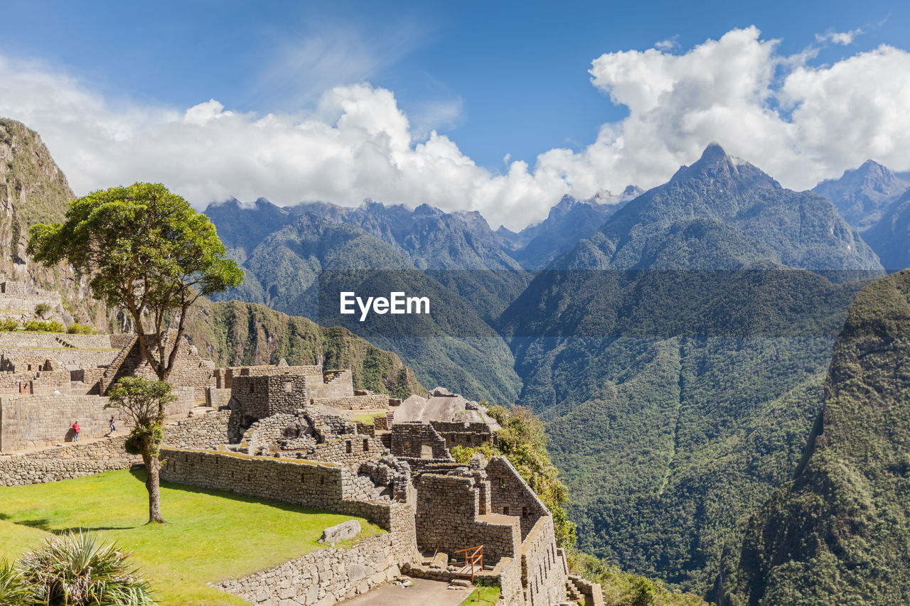 Scenic view of fort in mountains against cloudy sky