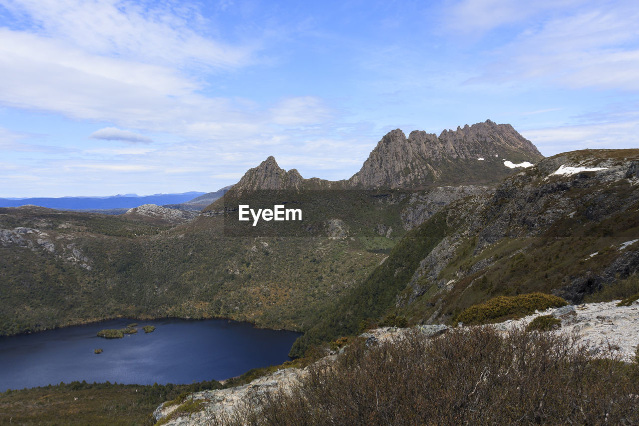 Scenic view of mountains and lake against sky