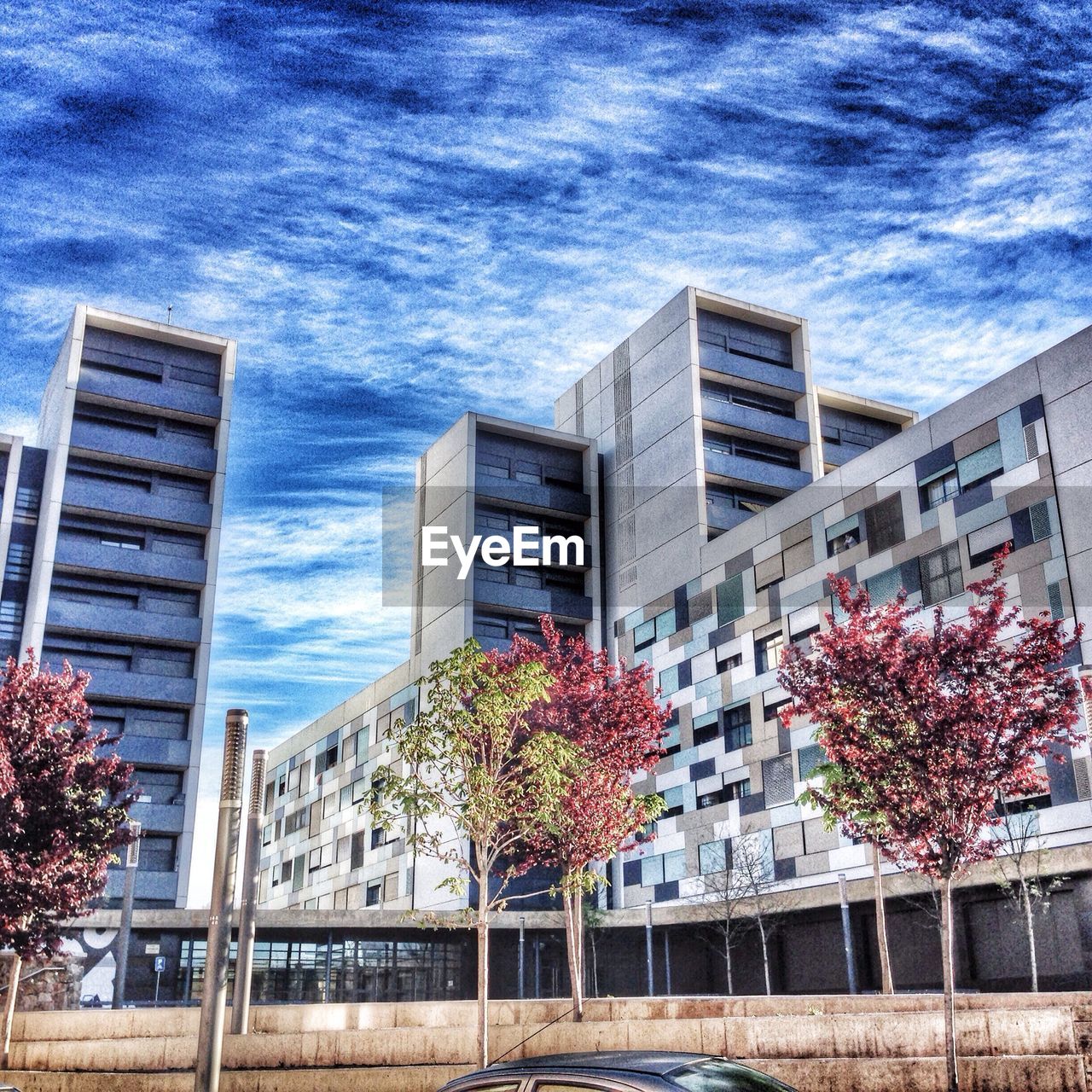 LOW ANGLE VIEW OF CLOUDY SKY OVER BUILDINGS