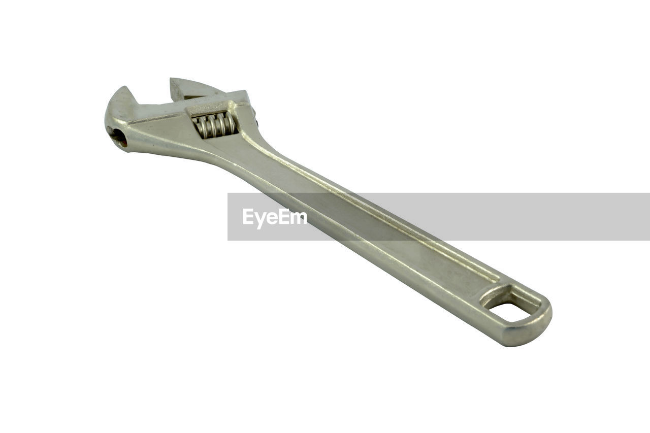 High angle view of wrench against white background