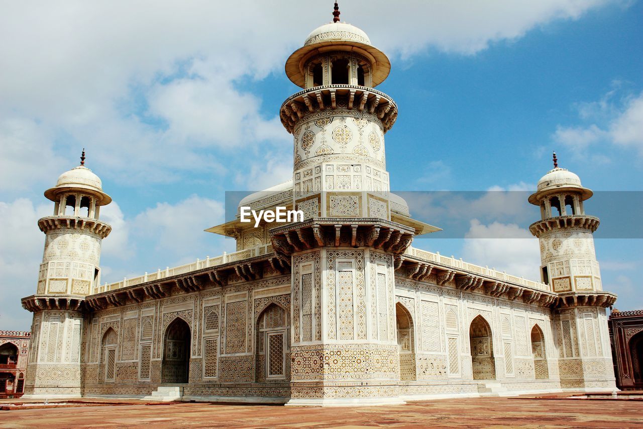 LOW ANGLE VIEW OF CHURCH AGAINST CLOUDY SKY