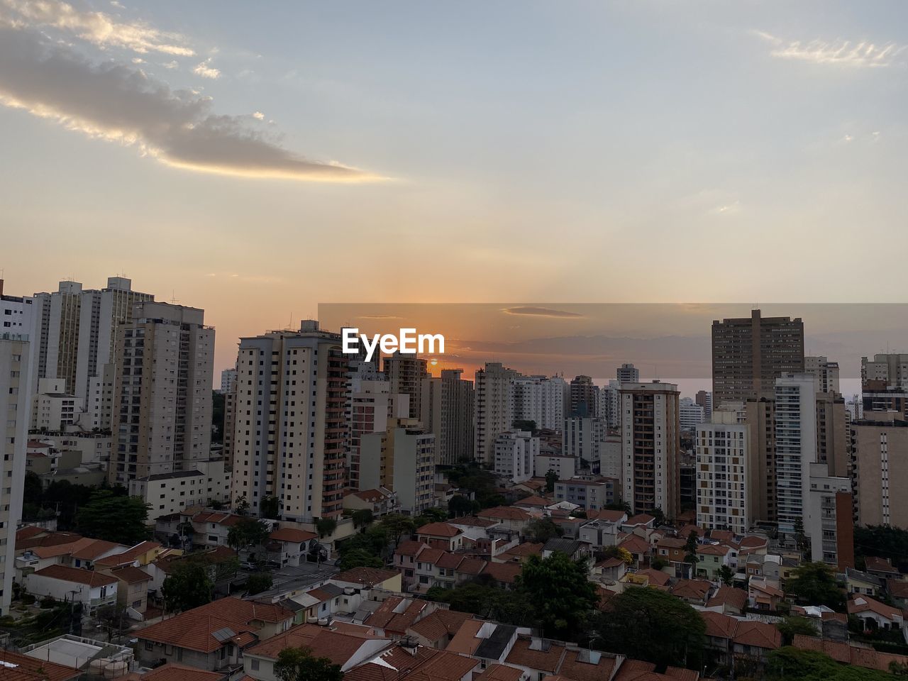 BUILDINGS AGAINST SKY DURING SUNSET