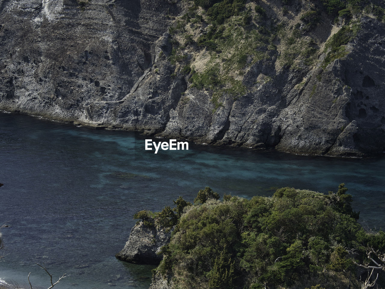 SCENIC VIEW OF SEA BY ROCKS