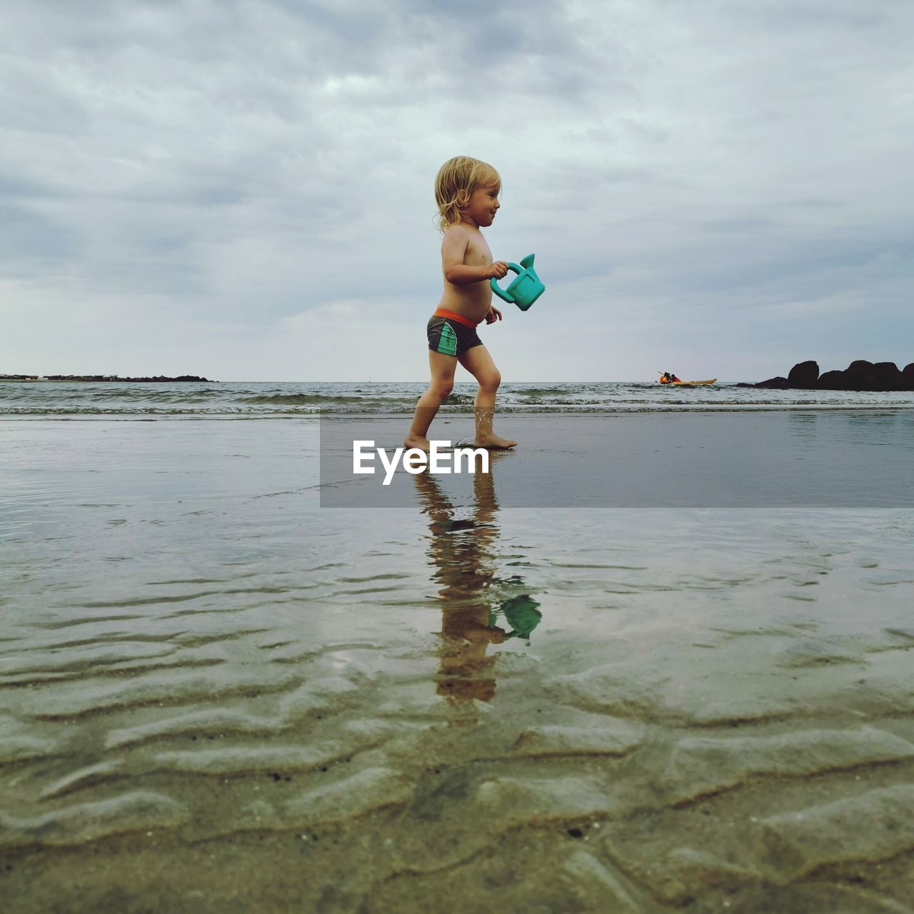 Small boy playing  in the sea.