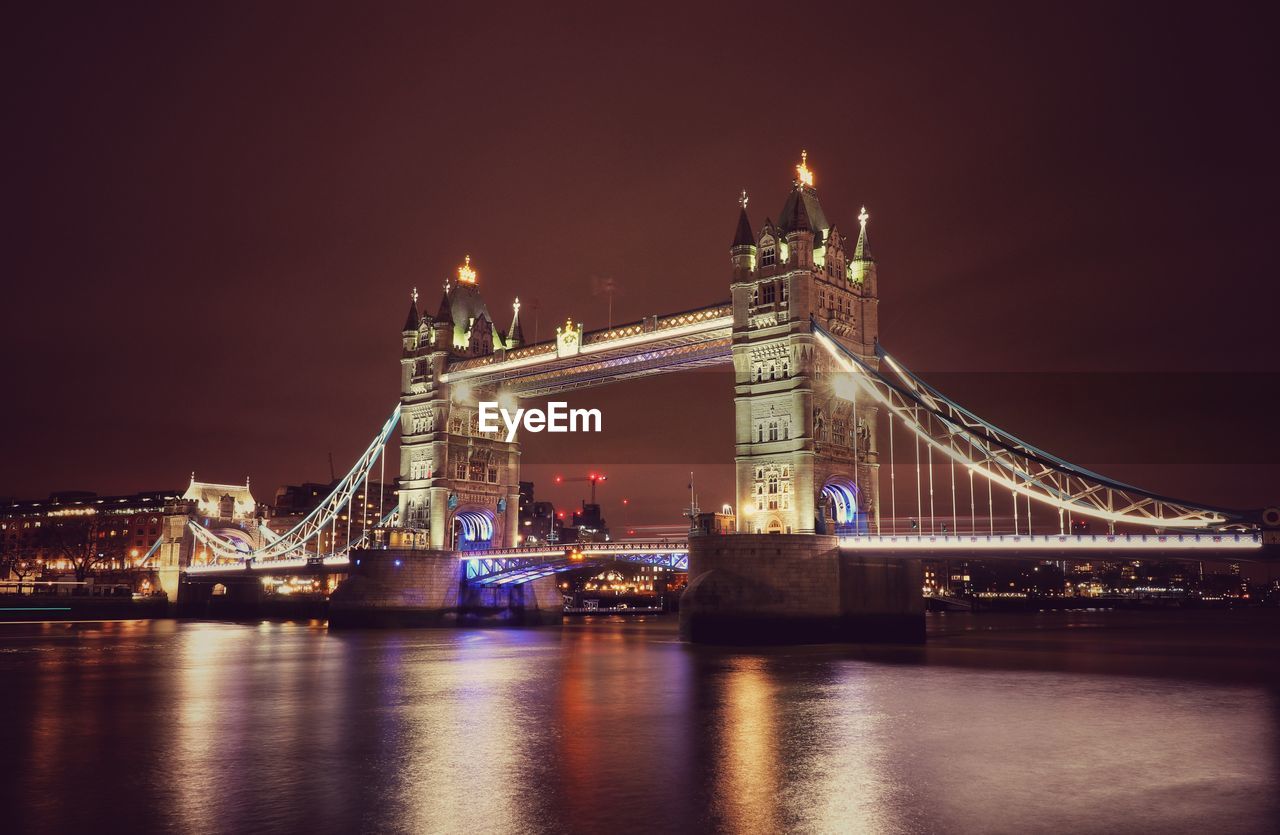 ILLUMINATED BRIDGE ACROSS RIVER